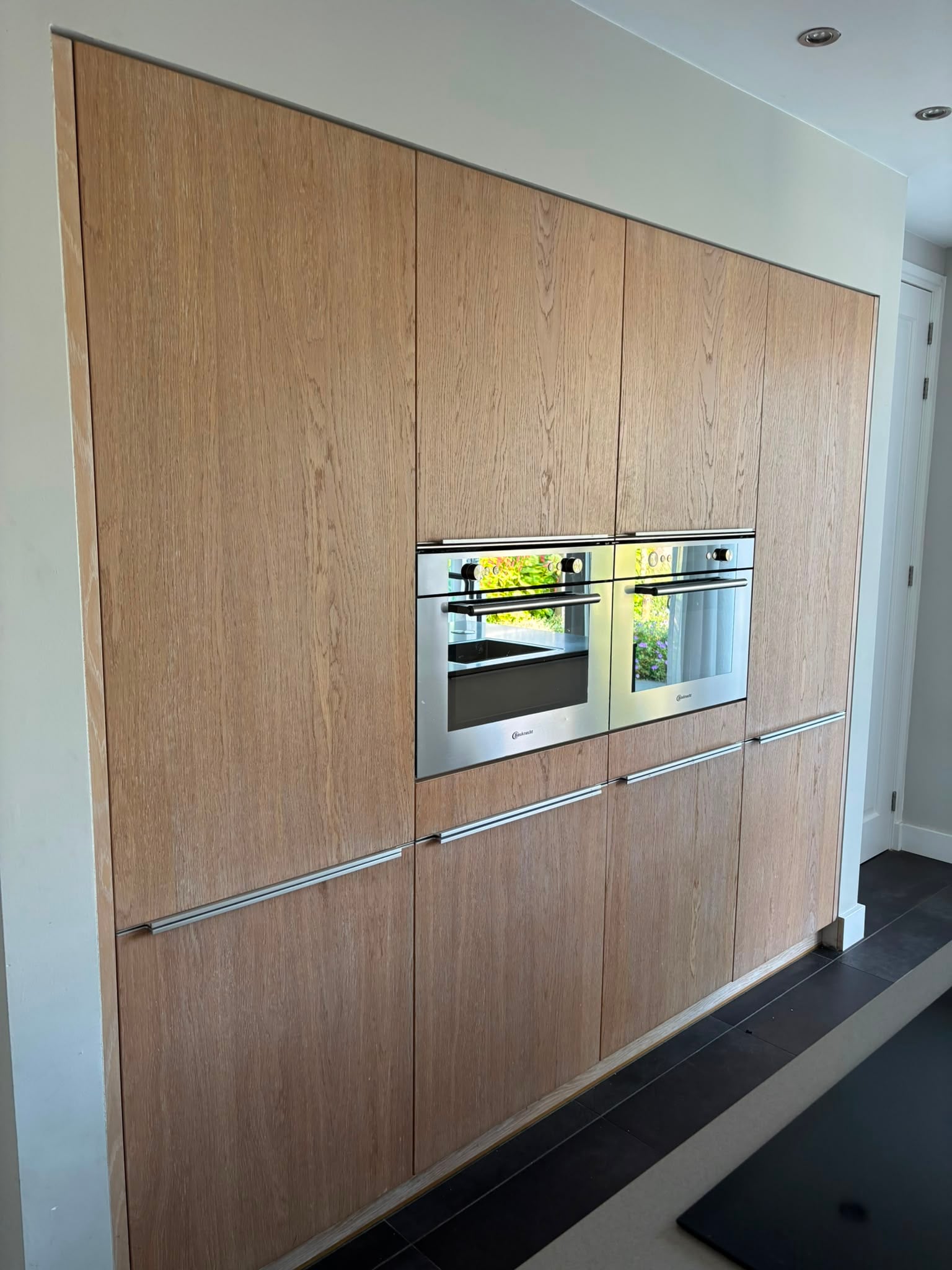 Prachtige Moderne houtkleur eilandkeuken met composiet werkblad & Quooker – €2.990 - Afbeelding 11