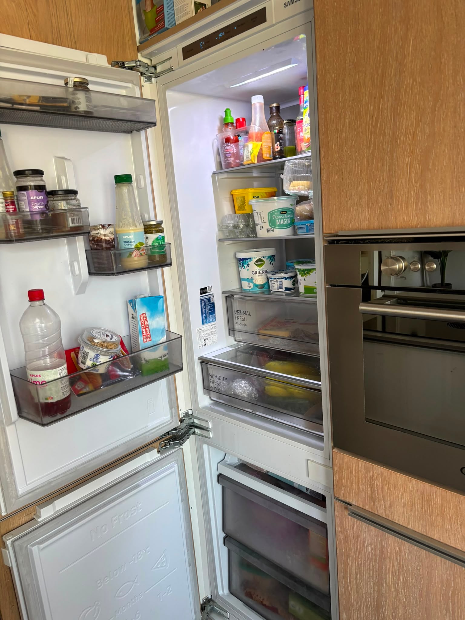 Prachtige Moderne houtkleur eilandkeuken met composiet werkblad & Quooker – €2.990 - Afbeelding 9